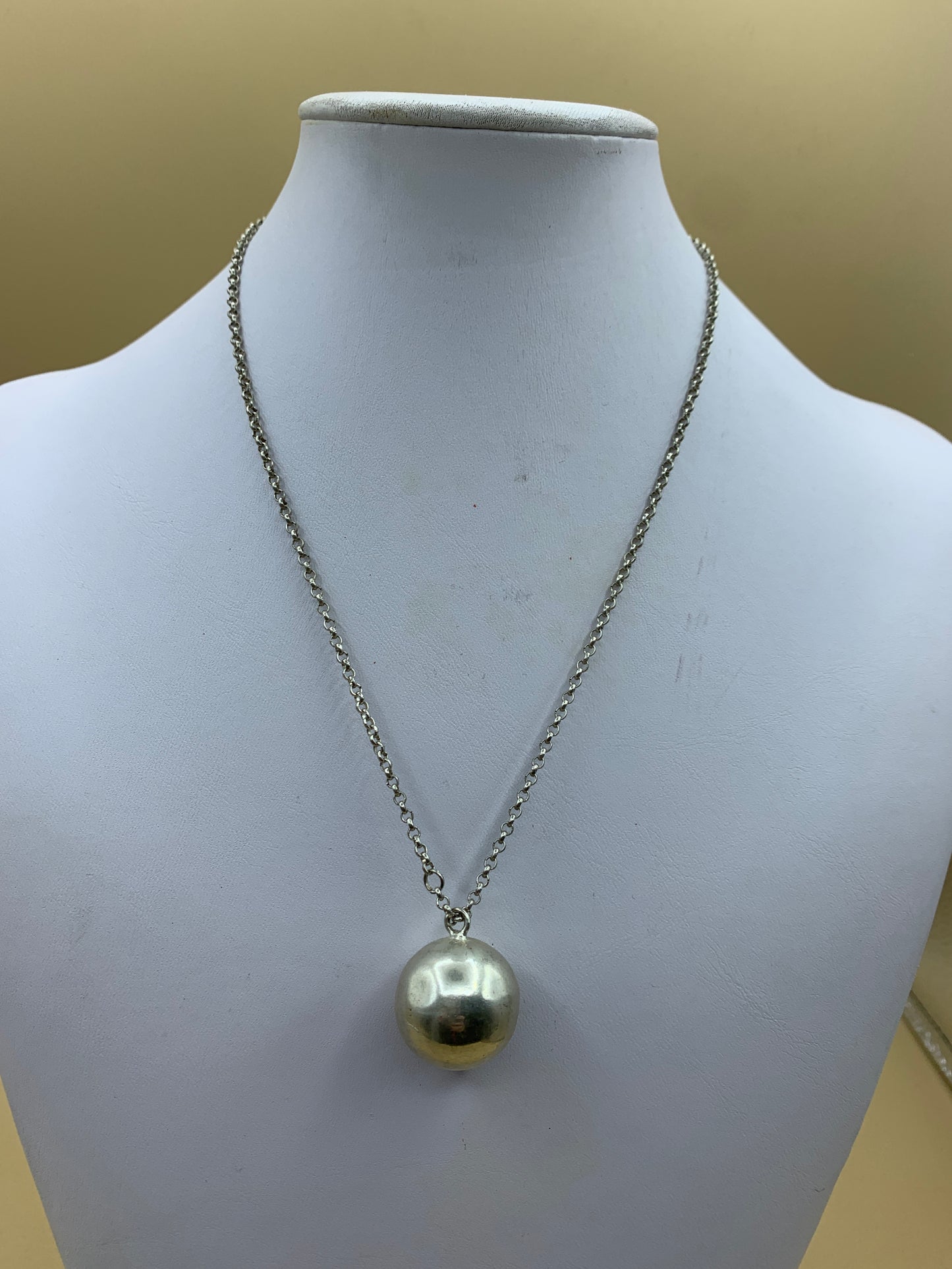 Necklace with rattle pendant calling angels