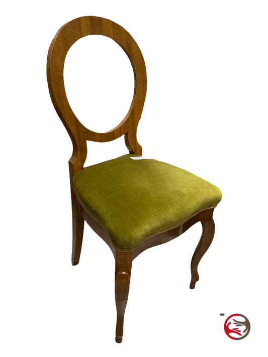 Armchair style chair with green velvet seat