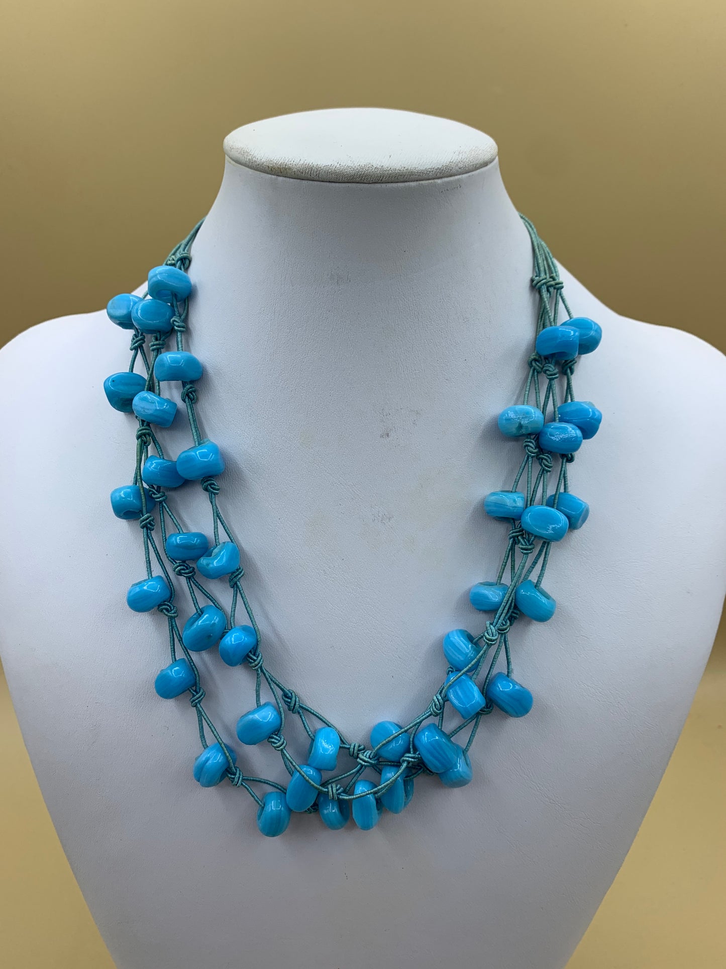 Multi-strand choker necklace with turquoise glass beads