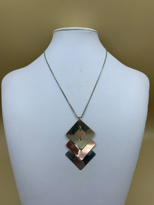 Necklace with three-color metal pendant