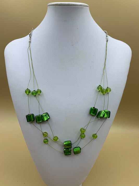 Multi-strand necklace with green glass beads