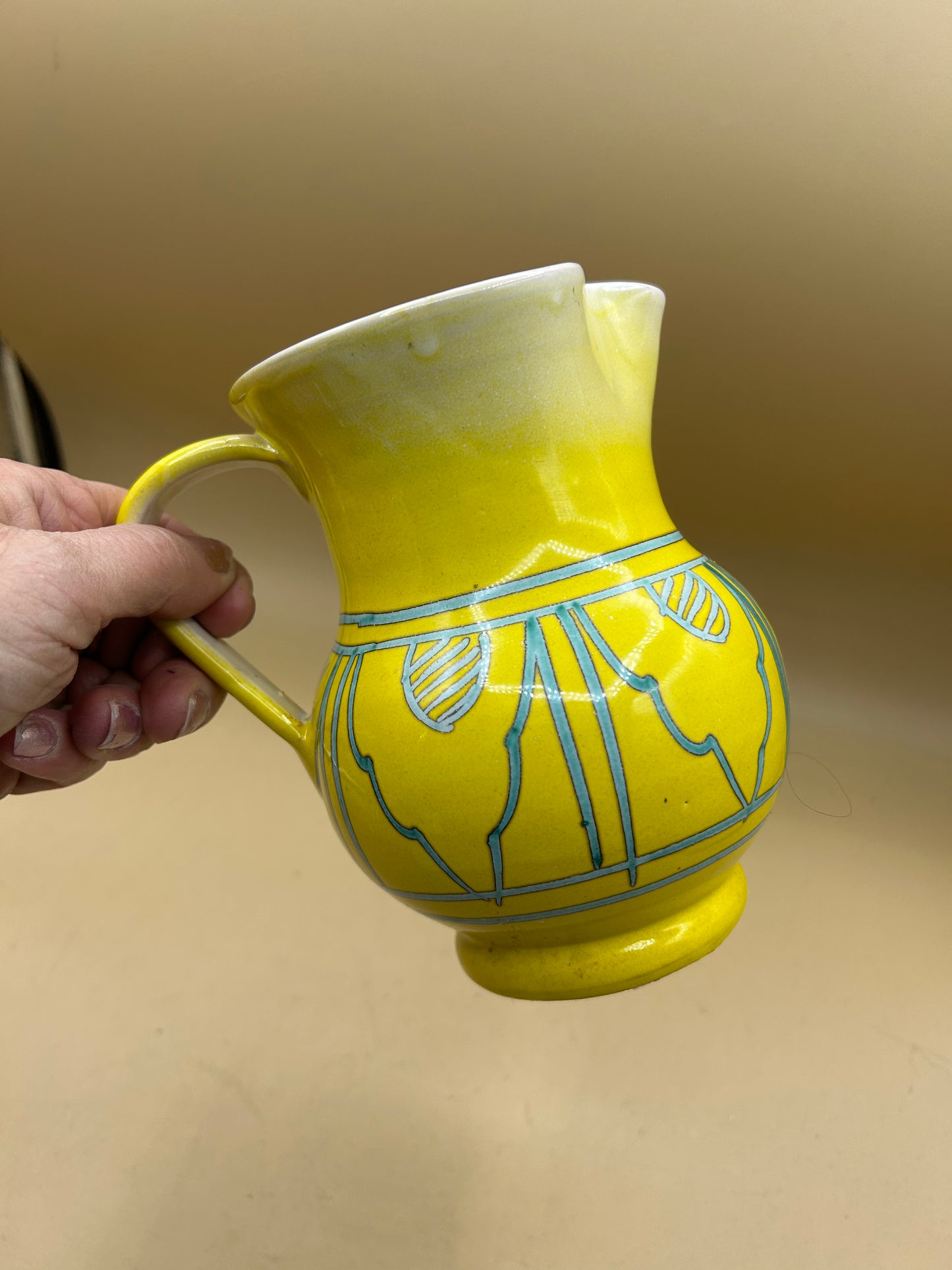 Hand-painted yellow ceramic jug