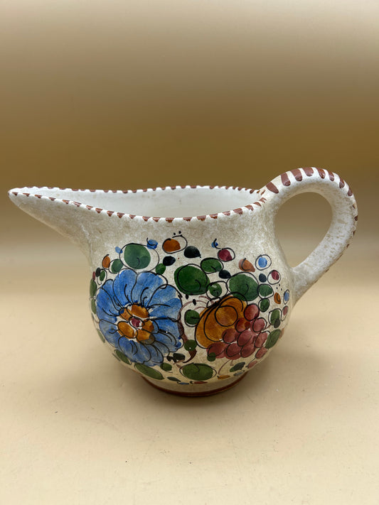 Hand-painted ceramic jug with flowers