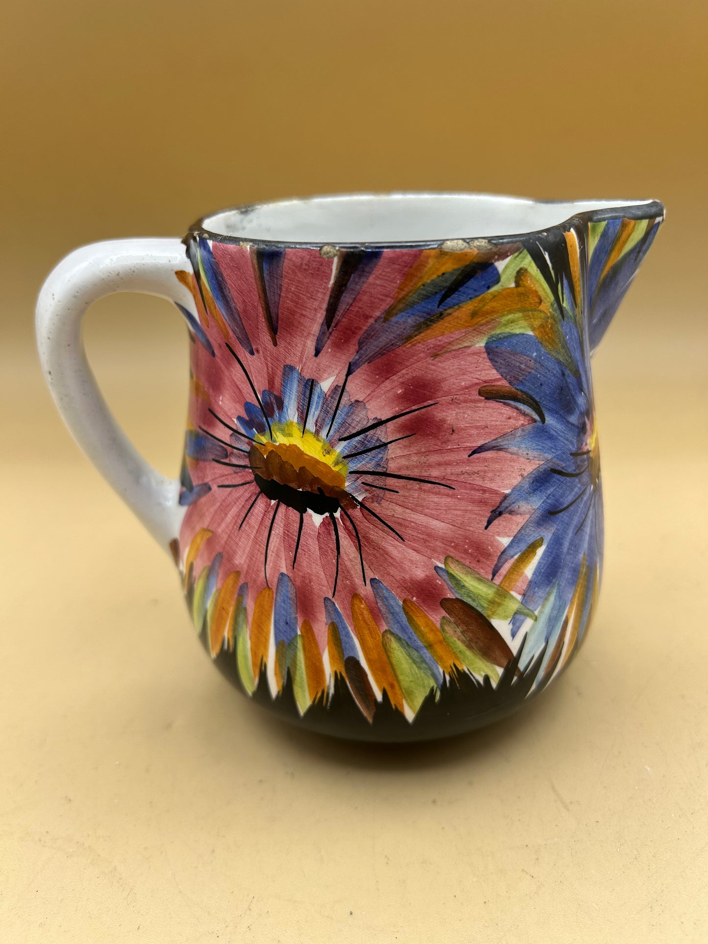 Hand-painted ceramic jug with flowers